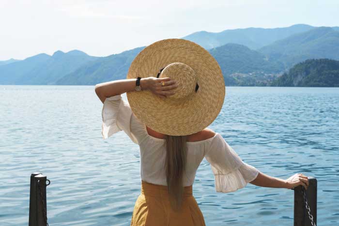 Women holding her Cap