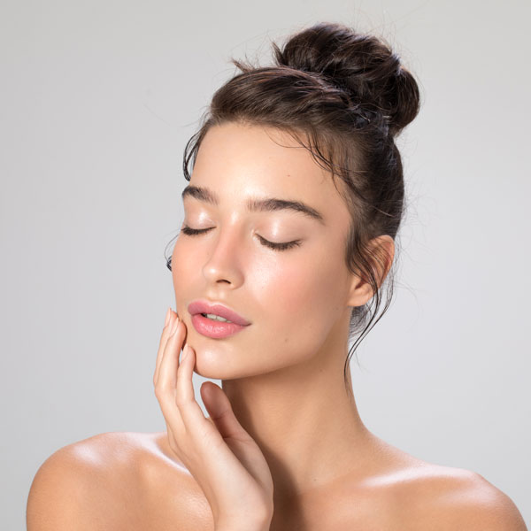 woman touching her face