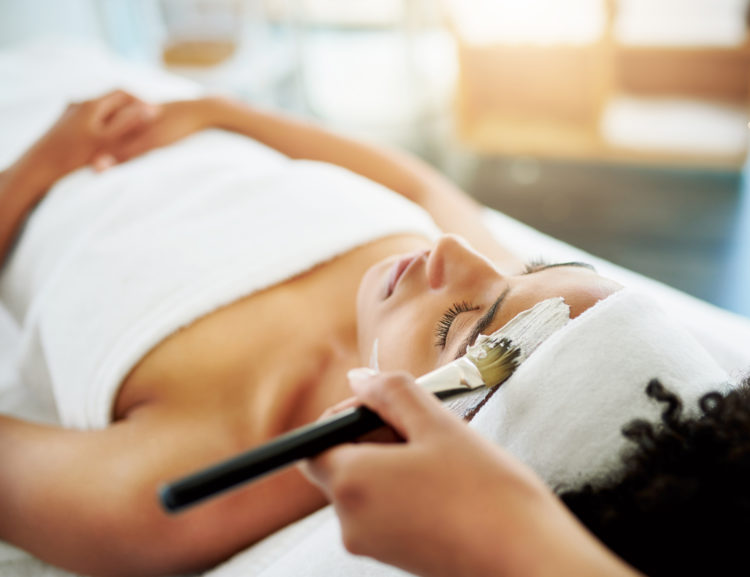 Shot of an attractive young woman getting a facial at a beauty spa