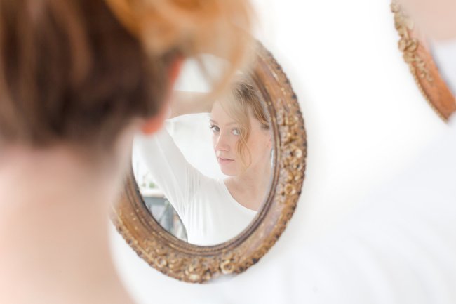 Young women looking into Mirror