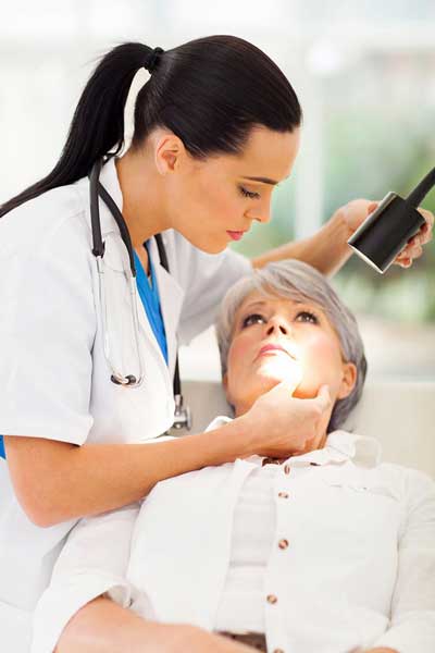 Doctor checking a women patient