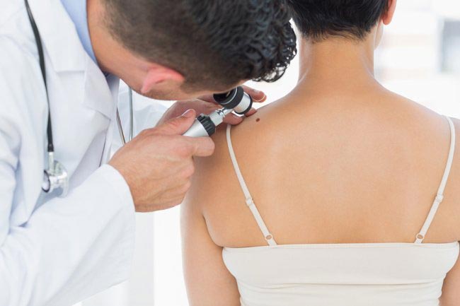 Male doctor checking patient