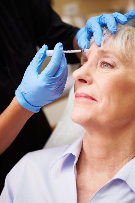 Doctor performing Botox treatment