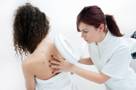 Woman at Dermatology Examination