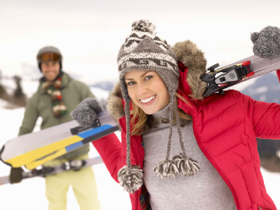 Woman in red jacket enjoying winter season