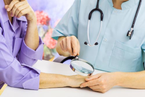 doctor checking female patient