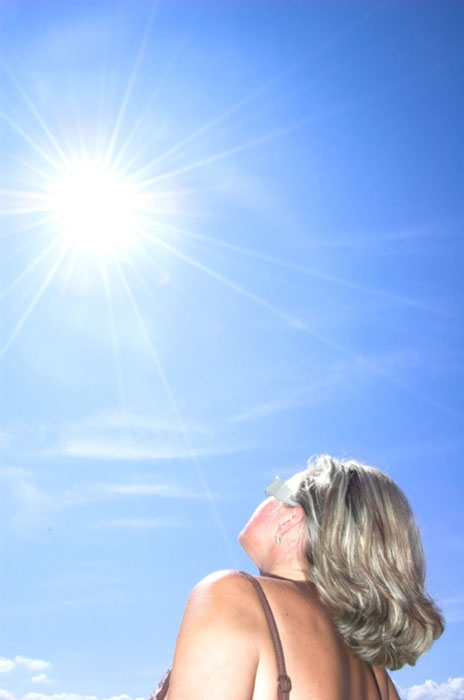 Woman looking at sun