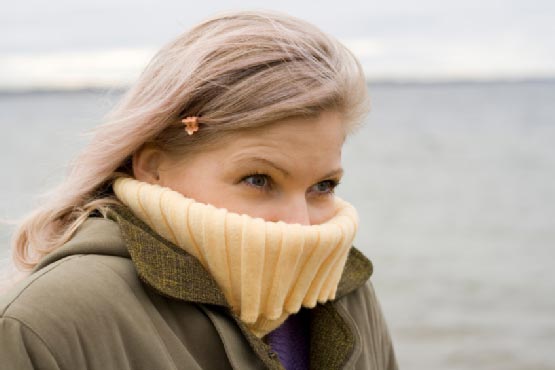 Woman covering her face