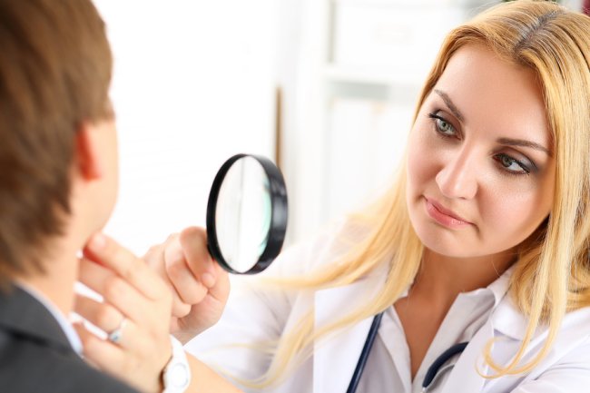 Female doctor checking patient