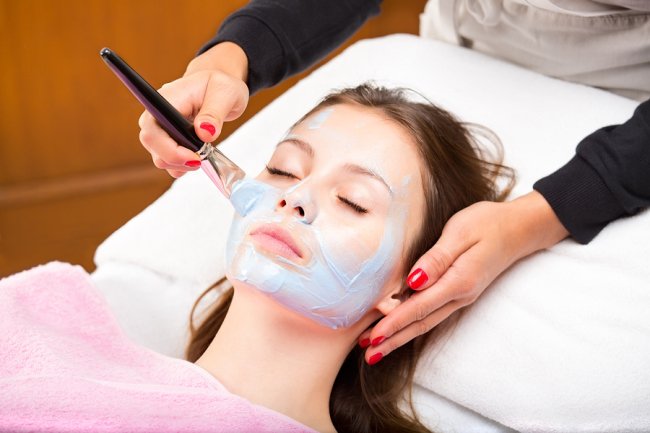 Applying Chemical Peel on a women face