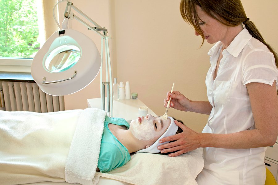 Women applying chemical peel on face
