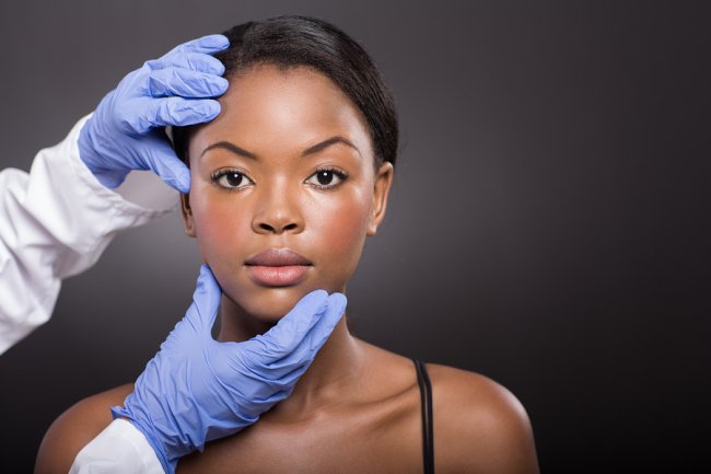 Doctor checking female patient