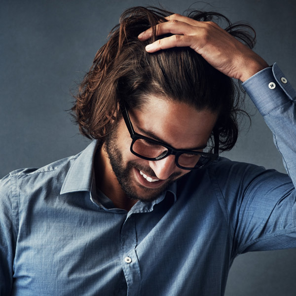 man touching his hair