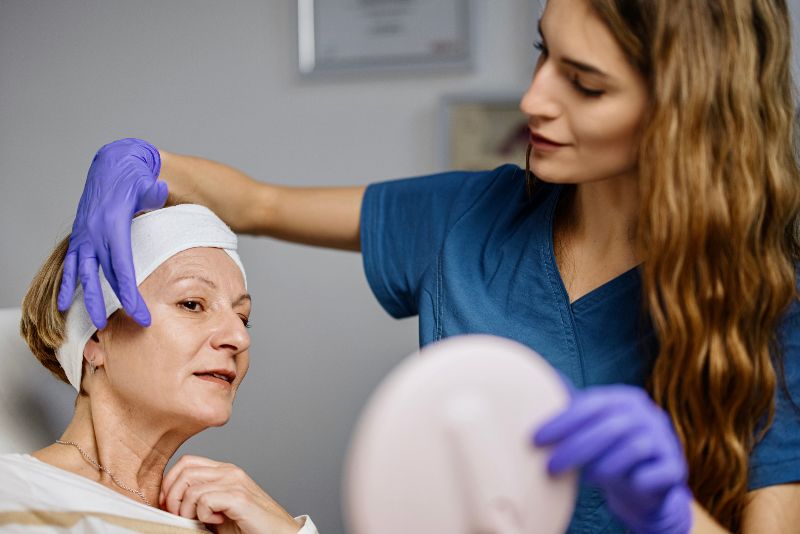 An older woman doing patch testing by Swinyer Woseth Dermatology